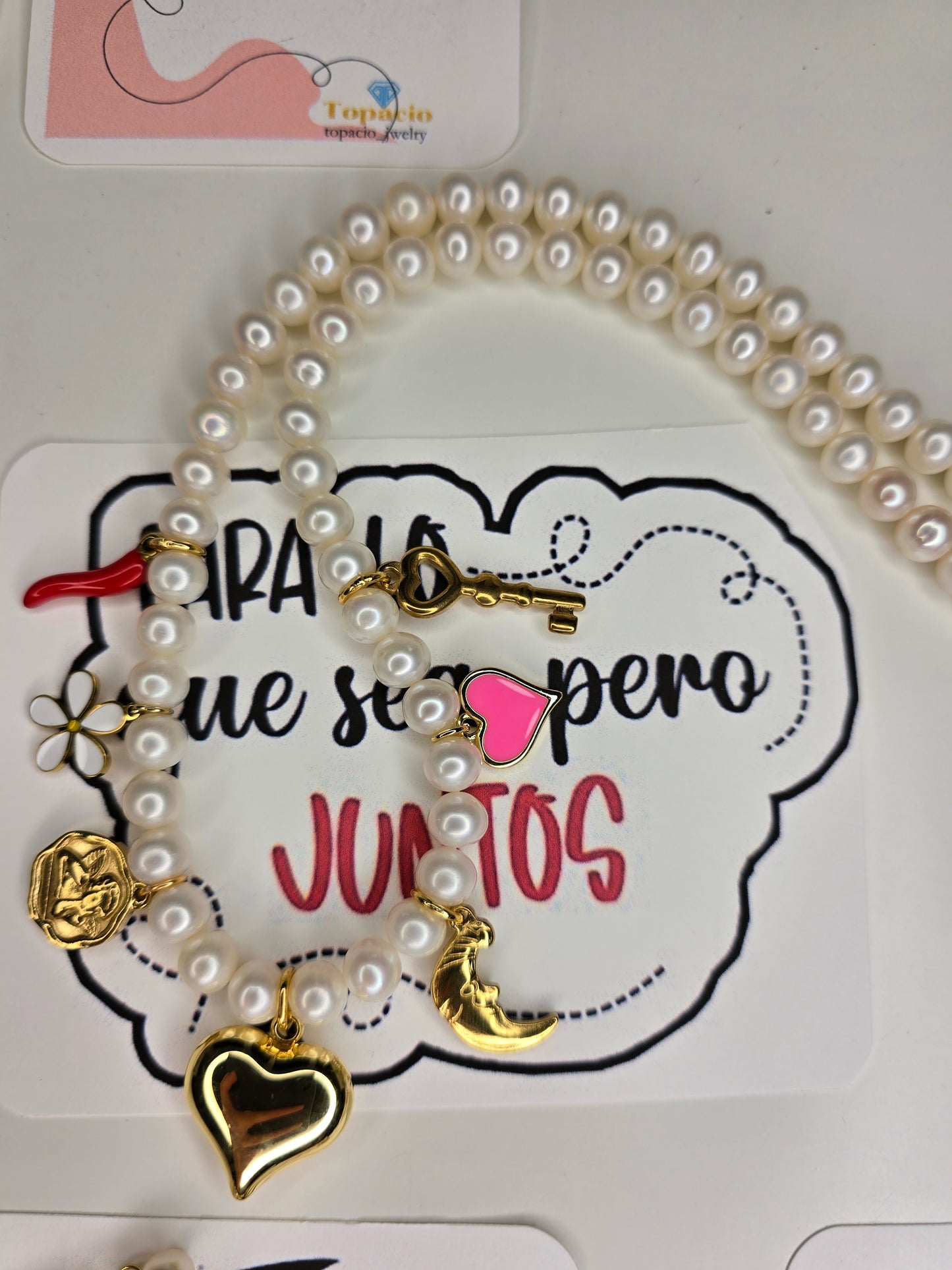 Charm with pearls